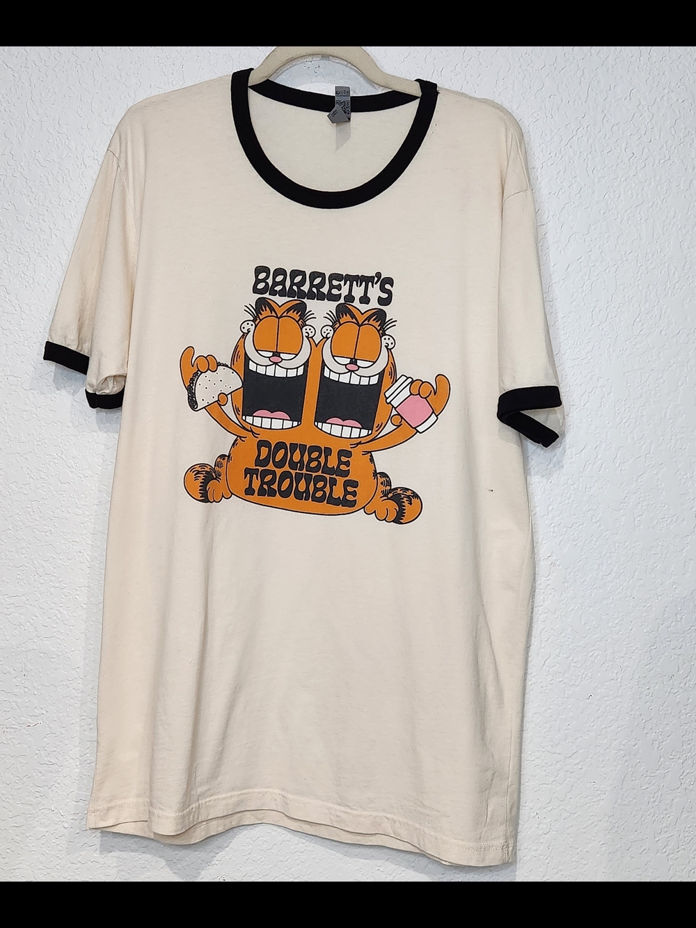 Next Level Apparel Cream Ringer Tee with Black Trim and Orange Graphic